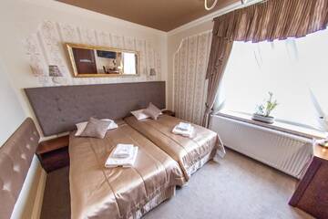 Фото номера Двухместный номер с 2 отдельными кроватями Отель Hotel Fryderyk г. Жешув 6